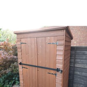 Garden shed with security bar fitted across it