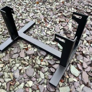 A black powder coated metal stand for a Vespa engine for use when building one