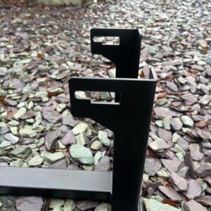 A black powder coated metal stand for a Vespa engine for use when building one