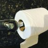 Toilet roll holder upcycled from a spanner title