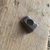 Small metal part which acts as a cable stop on a Lambretta rear brake