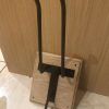 Motorbike helmet hanger, custom made with solid wooden base. 10mm solid round bar helmet hanger and hook for gloves/goggles/coat etc. Powder coated gloss black.
title
