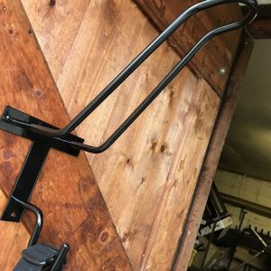 Motorbike helmet hanger, custom made with solid wooden base. 10mm solid round bar helmet hanger and hook for gloves/goggles/coat etc. Powder coated gloss black.
 title