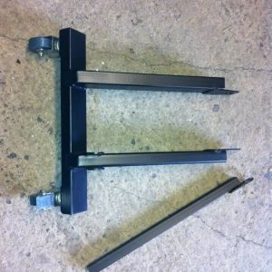 A dolly which fits to a scooter frame via the standard engine mount and the shock mount and allows you to move/store your engineless scooter with ease.  title