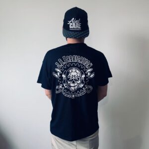 Rear view of model wearing black t-shirt with large JB Fabrication logo