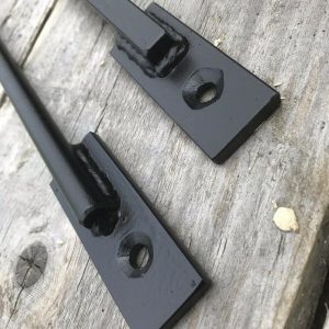 Security window bars painted white and made from 12mm solid round bars with laser cut 30x6mm ends drilled with 6mm holes and countersunk to accept security fixings.