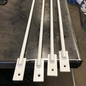 Security window bars painted white and made from 12mm solid round bars with laser cut 30x6mm ends drilled with 6mm holes and countersunk to accept security fixings.