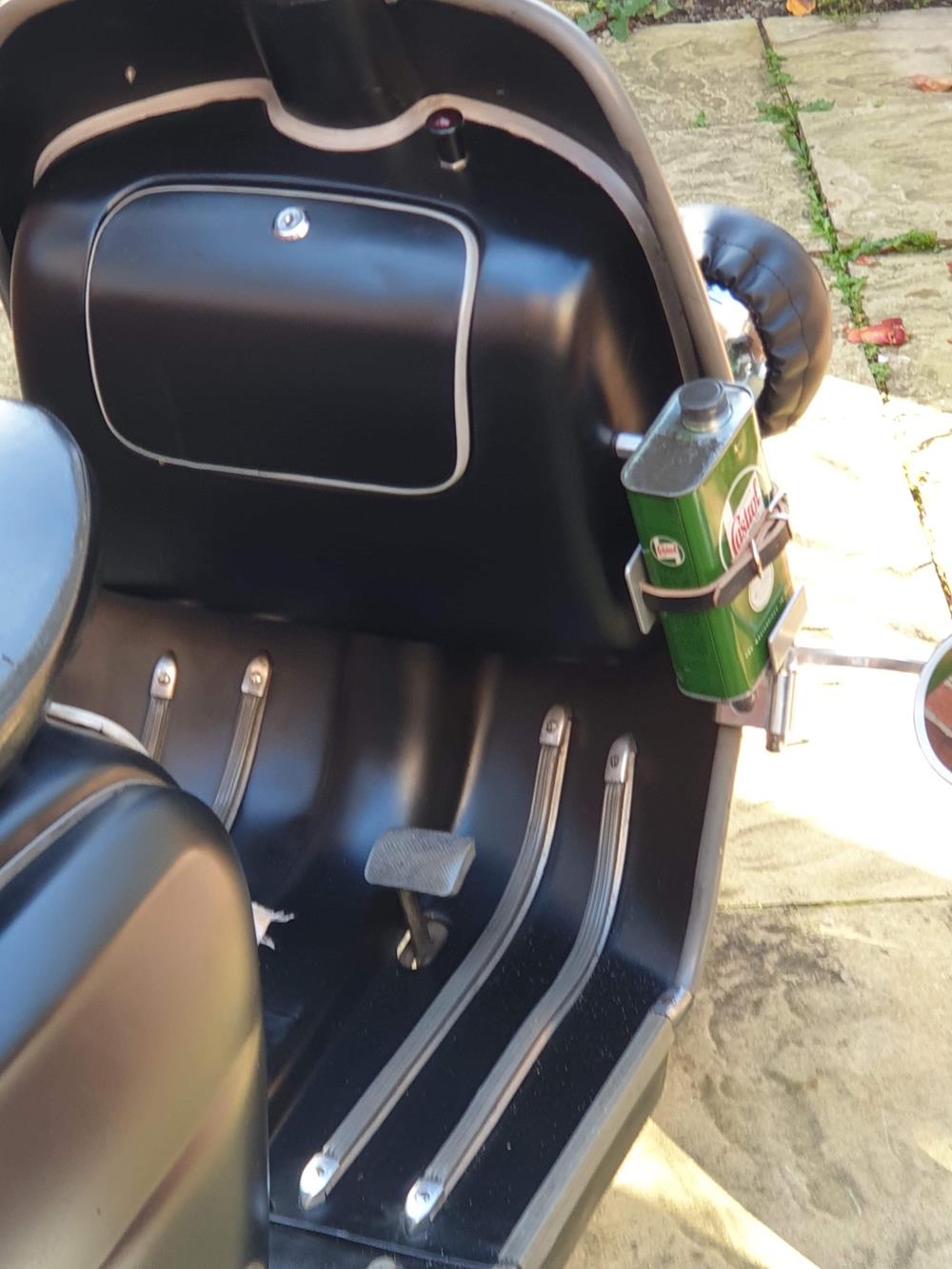 1 Pint castrol oil can in a carrier with a leather strap