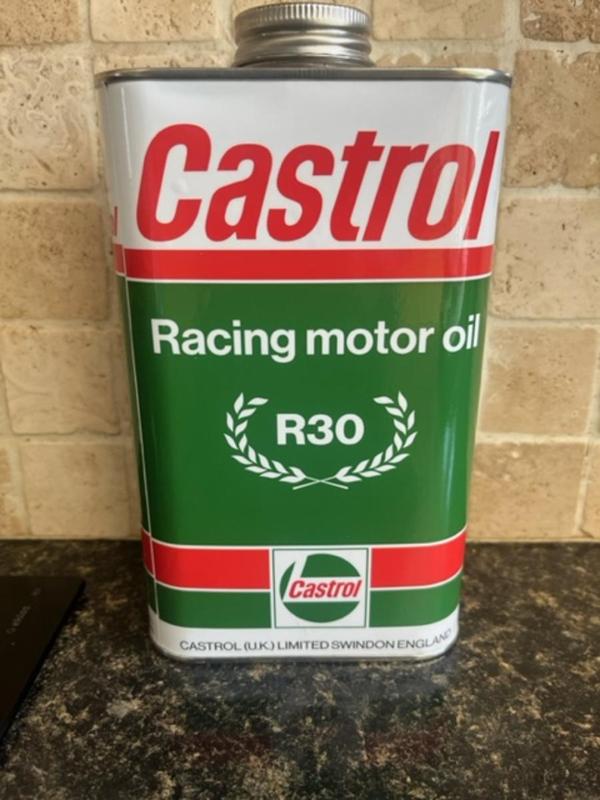white, red and green Castrol Racing motor oil can