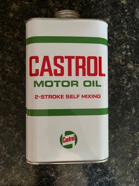 white, red and green Castrol 2-stroke self mixing motor oil can