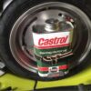 Closeup of spare wheel on a Lambretta Vega showing the Castrol oil can replica fitted
