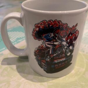 White mug with Eddie Kidd design on a motorbike designed by Ryan Lightfoot
