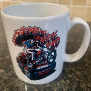 White mug with Eddie Kidd design on a motorbike designed by Ryan Lightfoot