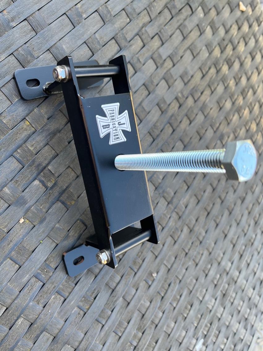Folding Lambretta clutch compressor tool shown in an open position with bolt screwed through the central mechanism