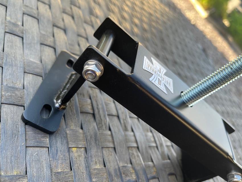 Folding Lambretta clutch compressor tool shown in an open position with bolt screwed through the central mechanism