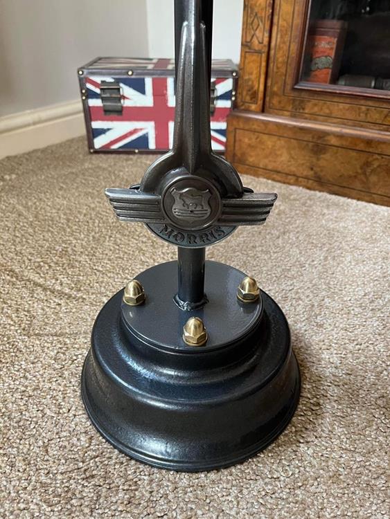 Closeup of the base of a morris minor coffee table featuring a Morris Minor badge