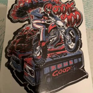 Sticker design featuring a graphic of eddie kidd jumping over vehicles on his stunt motorbike