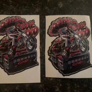 Two stickers featuring a graphic of eddie kidd jumping over vehicles on his stunt motorbike