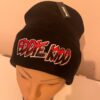 Black woollen beanie hat with Eddie Kidd design shown on mannequin