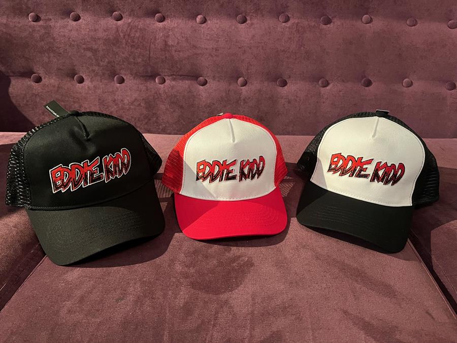 Three Eddie Kidd trucker caps in black, red and white, and black and white.