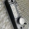 Close-up of rocker cover badge for a classic morris minor