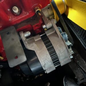 A bracket for a Morris Minor alternator/coil, shown in situ in a Morris Minor engine.