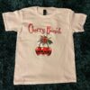 White ladies t-shirt with Cherry Bomb design, with a bunch of cherries and red skulls instead of cherry fruit.