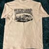 White t-shirt with Taildragger design in black on the front