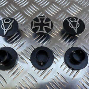 Set of 6 circular black toppers for dip and main beam switches in a car, with three shown facing up and three facing down so you can see the back of them.
