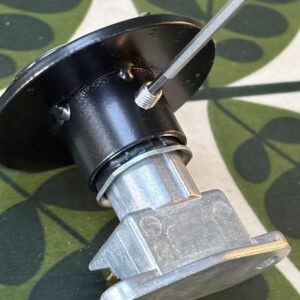 Closeup of a dip/main beam switch topper showing how it fixes to the switch.