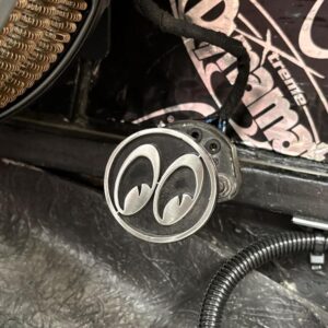Close-up of a dip and main beam switch with a funky topper on top.